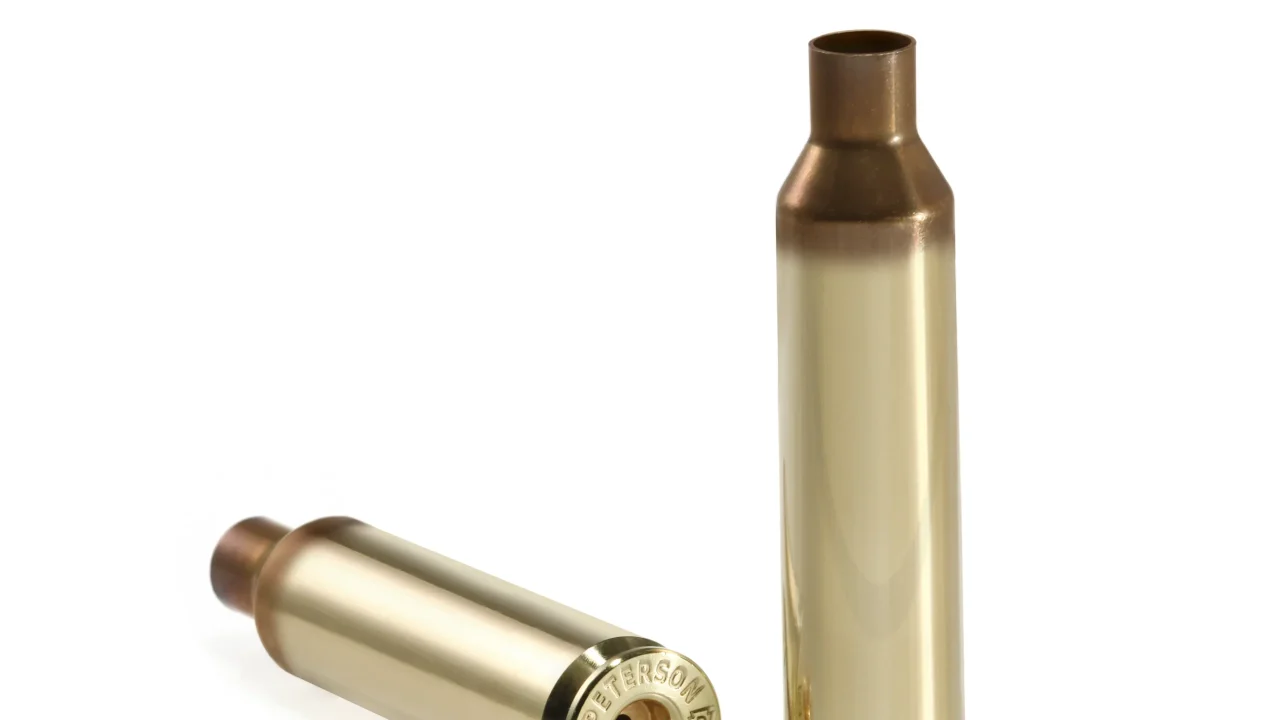 Two polished Peterson 7mm PRC brass cartridge cases for precision reloading