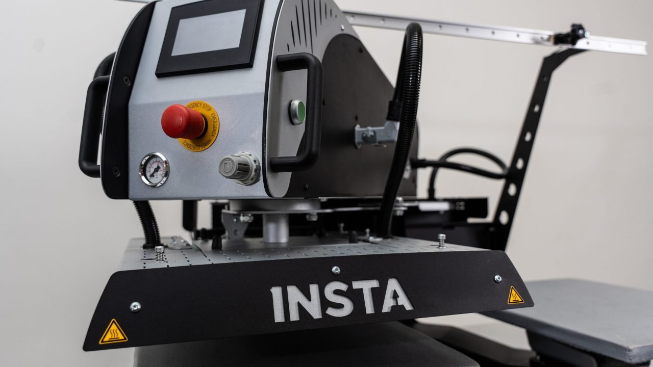 Insta Graphic Systems industrial heat press machine with digital controls and precision platen for heat transfer printing