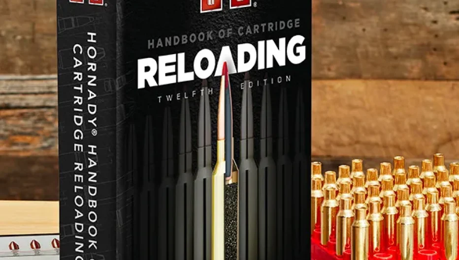 Hornady Handbook of Cartridge Reloading 12th Edition displayed on a reloading bench with brass cartridge cases, bullets, and measuring tools, highlighting reloading resources and supplies available from Precision Reloading