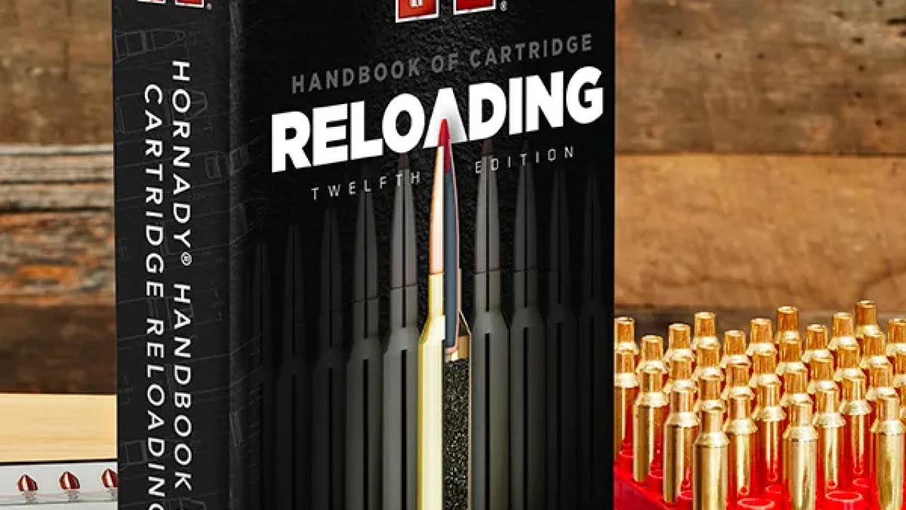 Hornady Handbook of Cartridge Reloading 12th Edition displayed on a reloading bench with brass cartridge cases, bullets, and measuring tools, highlighting reloading resources and supplies available from Precision Reloading