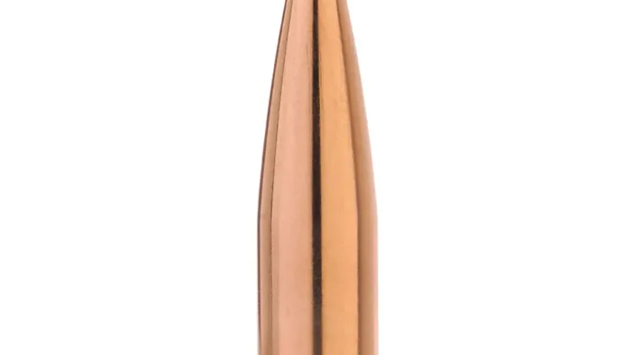 Close-up product image of a Sierra Bullets rifle projectile available from Precision Reloading featuring a copper jacket with a green polymer tip on a white background