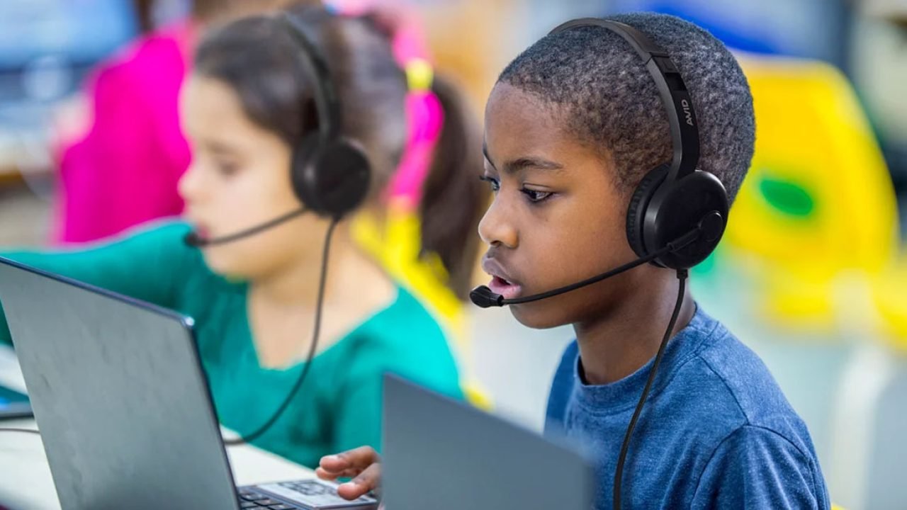 Students using Encore Data Products AVID classroom headsets with microphones during digital learning on laptops