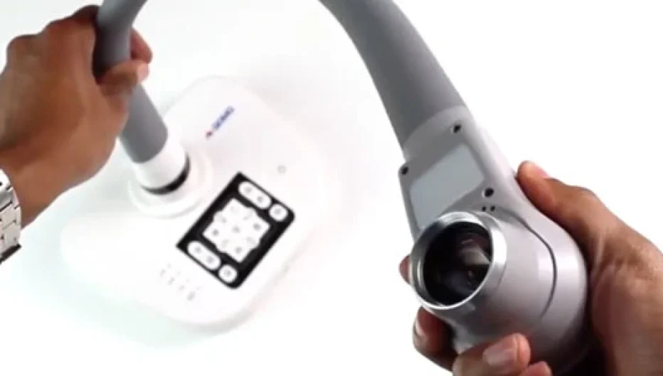 Hands adjusting a QOMO document camera with flexible arm and digital controls for classroom presentations, available from Encore Data Products